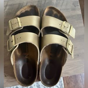 Birkenstock gold sandals size 38. Women’s size 7-7.5